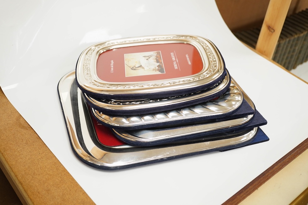 A modern pair of Italian sterling mounted photograph frames, 24.6cm, together with three other similar photograph frames. Condition - good.